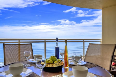 Table setting right on ocean front balcony