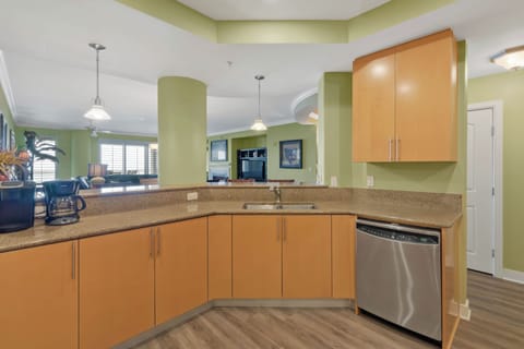 Kitchen with regular and Keurig coffee makers looking out into great room