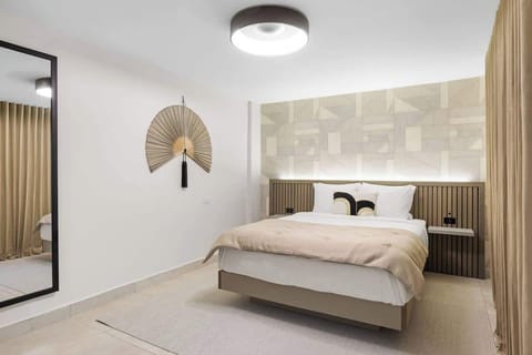Modern headboard with warm wood accents adds a touch of elegance.