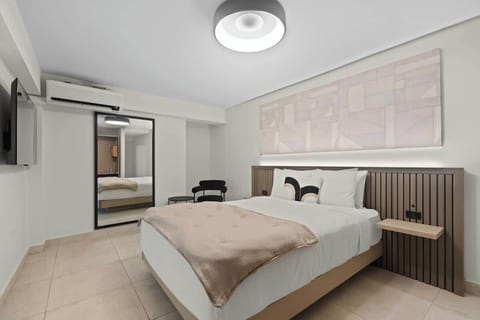 A vintage-inspired bedroom with large mirror.