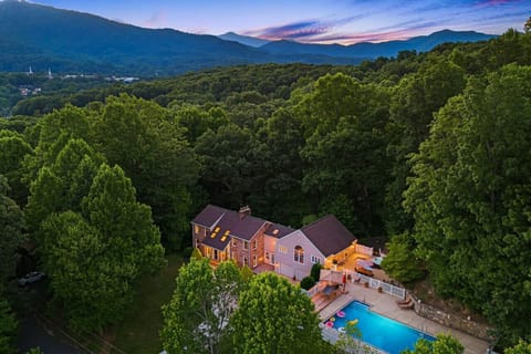 Gorgeous modern home with virtually every amenity, nestled in private wooded area with beautiful foliage