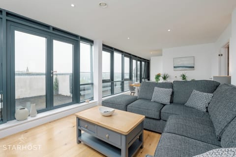 Spacious living room with lounge, kitchen and dining areas