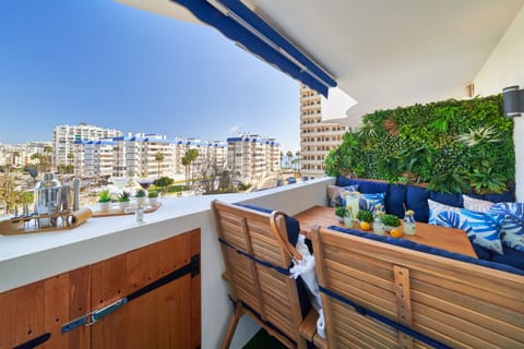 Terrace with outdoor dining area and sea view.
