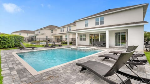 Relax in your private oasis with a sparkling pool, hot tub, and ample seating—perfect for entertaining or unwinding under the sun.