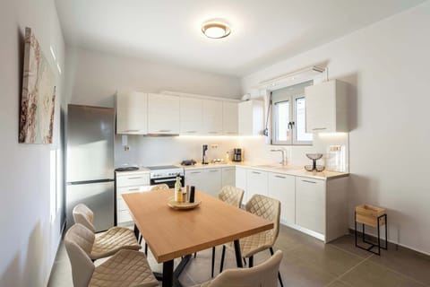 Spacious Open Interior with Kitchen and Dining Area in View

