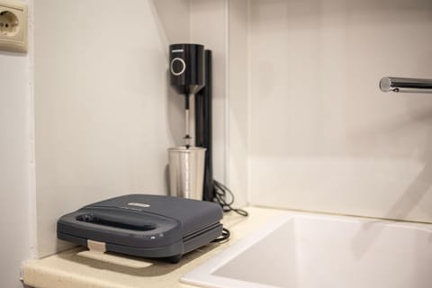 Compact Coffee Station with Espresso Machine and Cups

