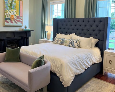The Zeus Guest Room in The Athenian Historic Inn, features premium mattress, king size bed, and walk in shower