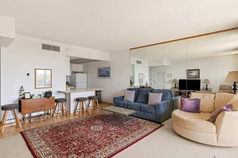 Cozy living with a view! Relax by the fire and still catch glimpses of the ocean and mountains.