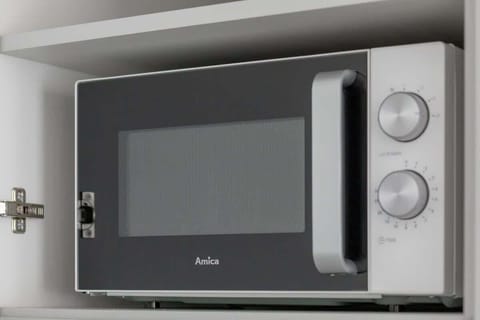 Bright kitchen with cooking utensils.