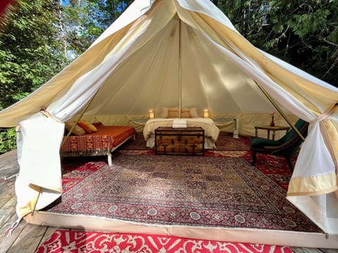 Bell Tent showing daybed on left, Queen Bed, hot/cool Dyson fan