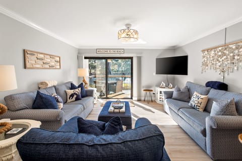 Spacious living room with 2 sofas (one is a queen sleeper) and plush chair