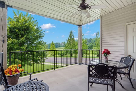 Extended Covered Patio with Nice Seating and a Ceiling Fan