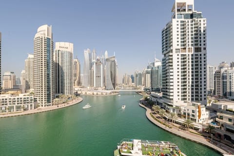 Stunning view of Dubai Marina from Marina View Tower B, showcasing luxury high-rises and serene waterfront. Ideal for guests seeking a holiday home, vacation rental, or short-term rental in Dubai Marina with a breathtaking skyline and water view.