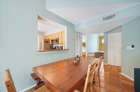 The dining area features a spacious 6-seater table, perfect for enjoying meals with family and friends.