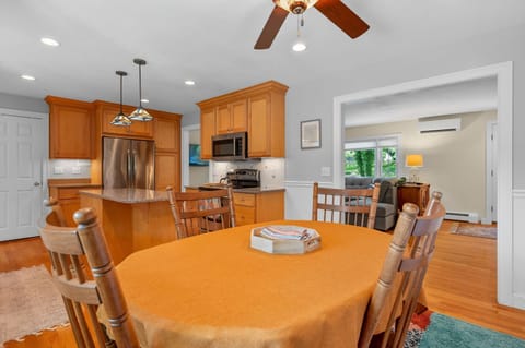 Dining area open to kitchen, living room and sun room