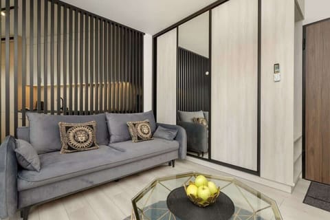 Living room with a comfortable sofa and TV. 