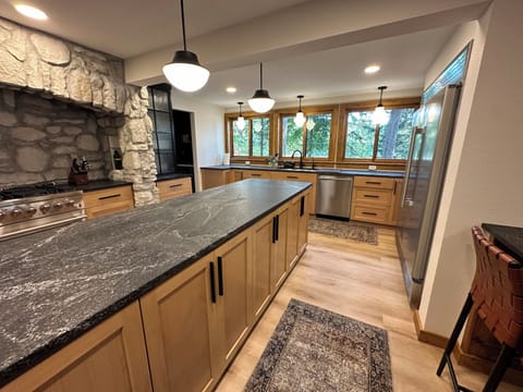 Kitchen facing the lake and outdoor cooking area.