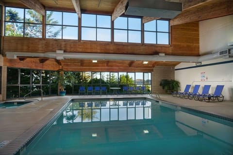 Unwind poolside with roomy loungers and soaring timber ceilings.