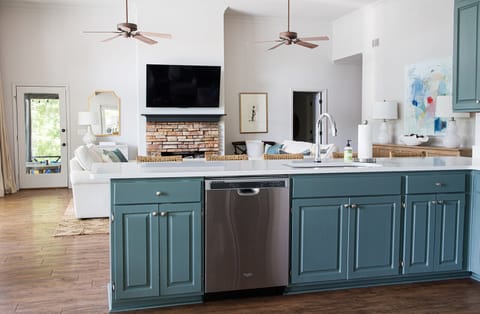 Open and airy view from kitchen into living room