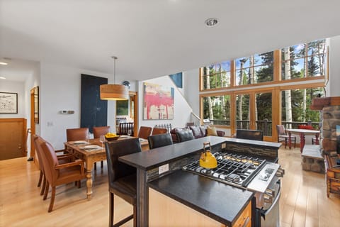 The dining Kitchen area is a spacious open space overlooking the living room with stunning views of the mountains outside.