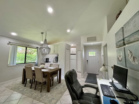 The office work desk is located in the general are between the living room and dining area. A comfortable desk chair and monitor gives you a great place to get work done if needed.