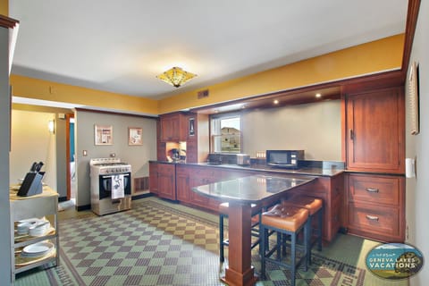 Spacious, fully-equipped kitchen with island seating. Please note sink is smaller than average.
