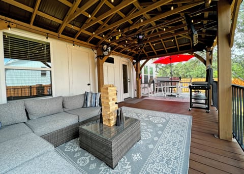 Relax and enjoy coffee or a cocktail on the spacious covered patio.