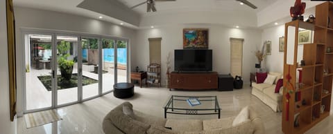 Spacious lounge room overlooking internal courtyard and fish ponds