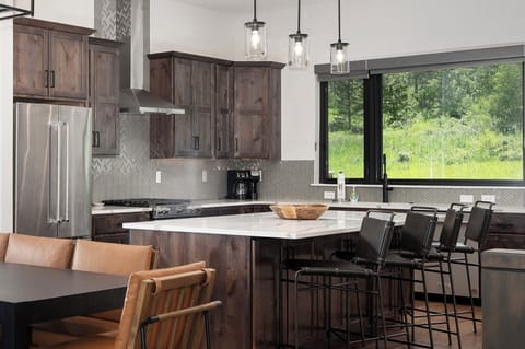 Open concept main level with dining area and large, fully equipped kitchen