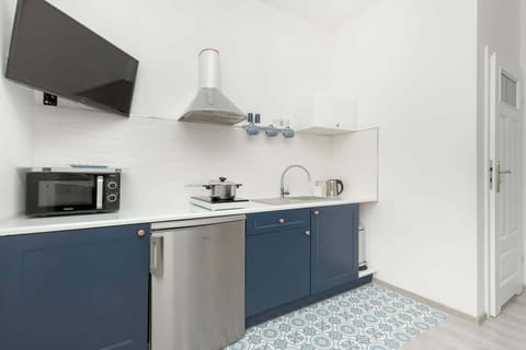 Kitchenette with television.