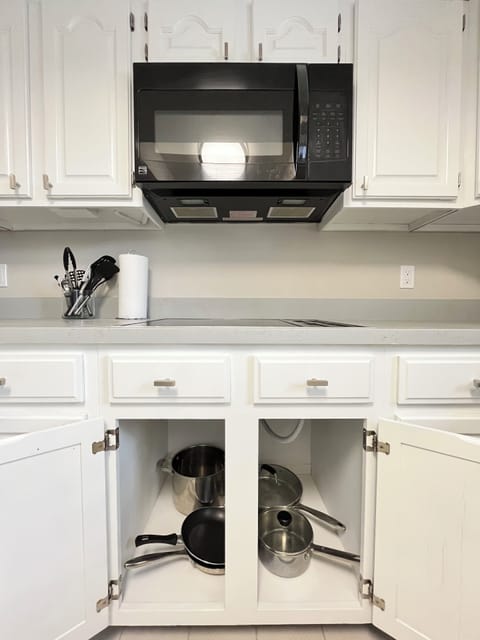 Microwave, stove and pots/pans