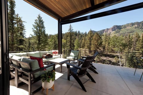 Deck off the main living space - Hot Tub, couches, dining table and BBQ