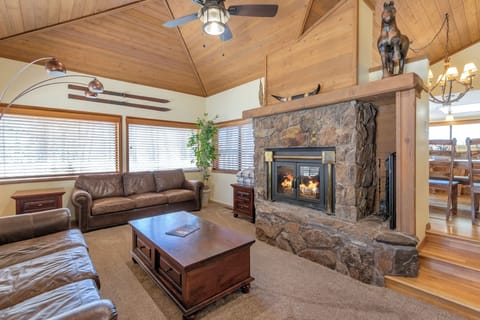Sunken living room with natural light, smart TV and two full size couches