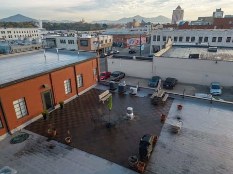 Rooftop patio with open views and outdoor seating