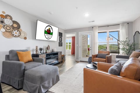Living Area with Cable TV, Electric Fireplace, and Deck Access