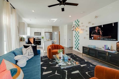 5623 - Bright and open living space draped in designer furnishings. Complete with sofa, smart TV, and 2nd floor balcony.