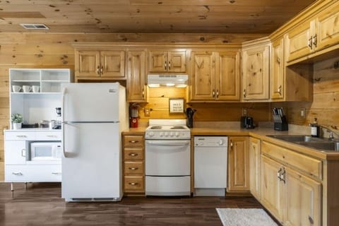 Kitchen with appliances and utensils to bring home-cooking to your cabin..