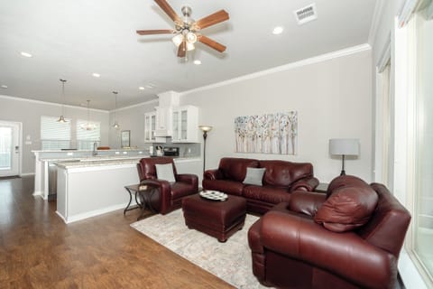 Living room with view towards kitchen and dining