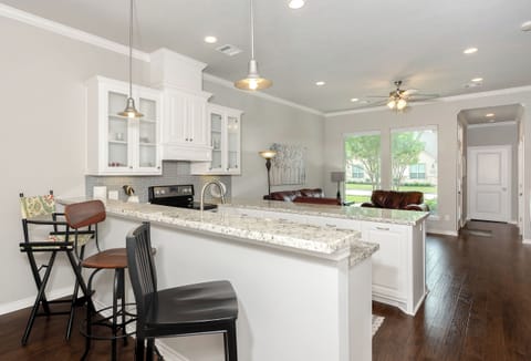 Kitchen with view towards living room and front door