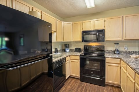 Full kitchen includes stove top, oven, microwave, dishwasher, refrigerator, and more!