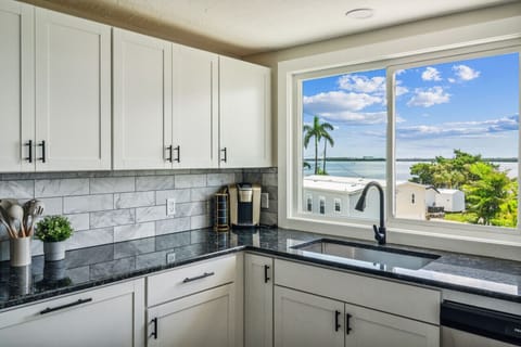 Fully equipped kitchen with stainless steel appliances and ample counter space