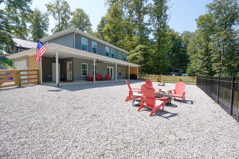 Outside area with firepit, grill, and patio furniture. 