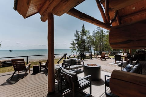 Ample outdoor seating on expansive deck! This area features a propane fire pit