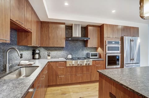 Fully equipped kitchen with modern appliances, granite countertops, and ample storage space for all your cooking needs.