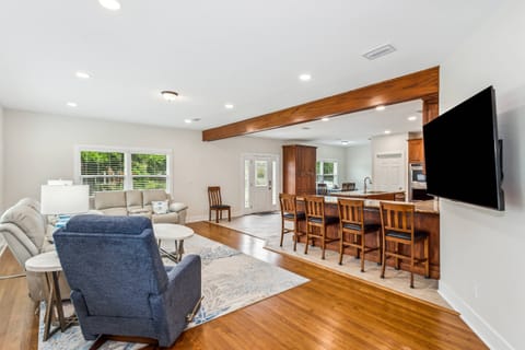 The living room opens to the kitchen and dining areas