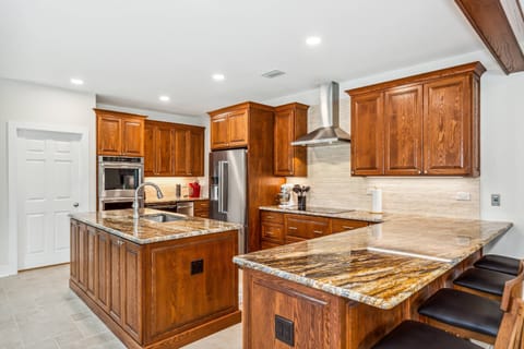 Beautiful gourmet kitchen with brand new granite counters, cabinets, and high end stainless appliances