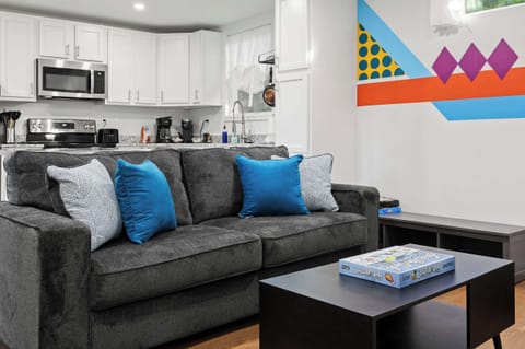 Living Room: Enjoy modern comforts in the eco-friendly ambiance of our home