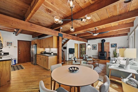 The expandable dining table is open to the kitchen and living room.