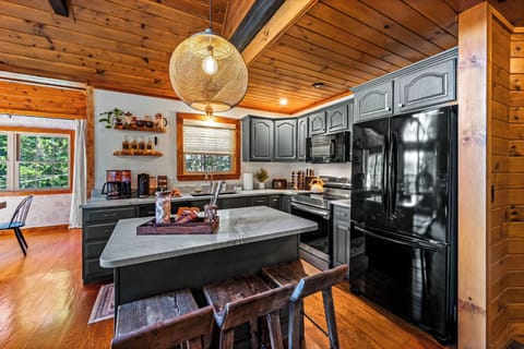 The kitchen includes a full refrigerator, dishwasher, oven, stovetop, and microwave!