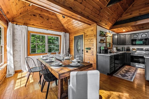 Our charming dining room, conveniently located right next to the kitchen, makes serving meals easy and enjoyable for creating beautiful memories.